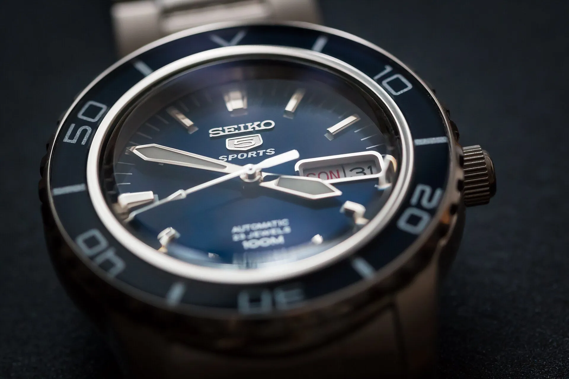 Blue dial of a Seiko 5 Sports, close up