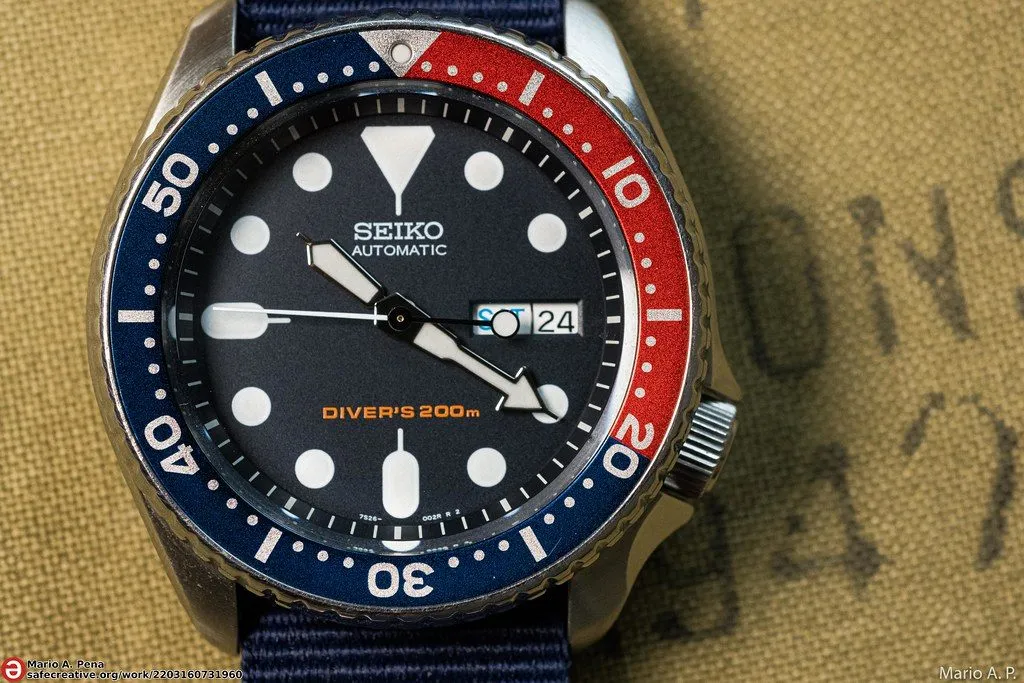 Seiko SKX009 with a blue and red bezel
